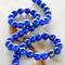 12 Pack: Blue Reconstituted Lapis Round Beads, 4mm by Bead Landing™